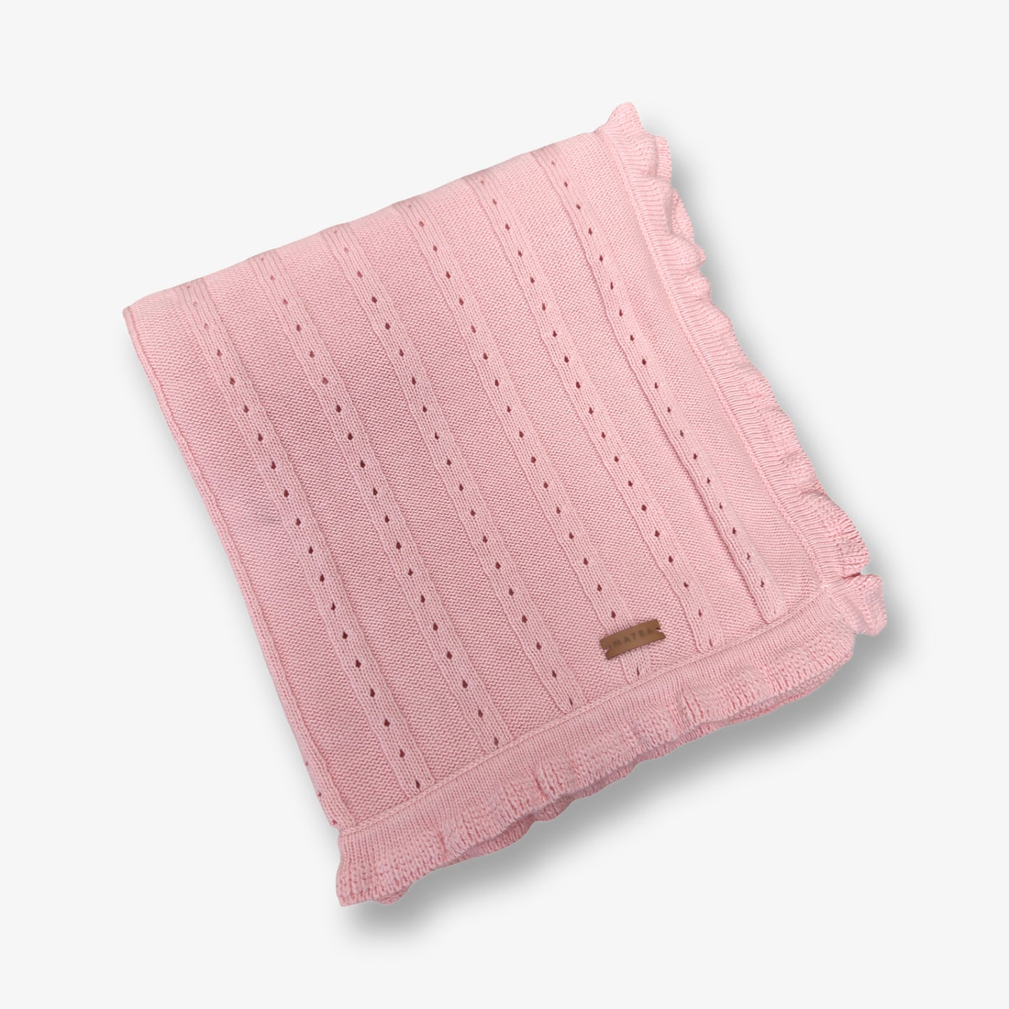 Manta tejida en hilo de algodón en tono rosa