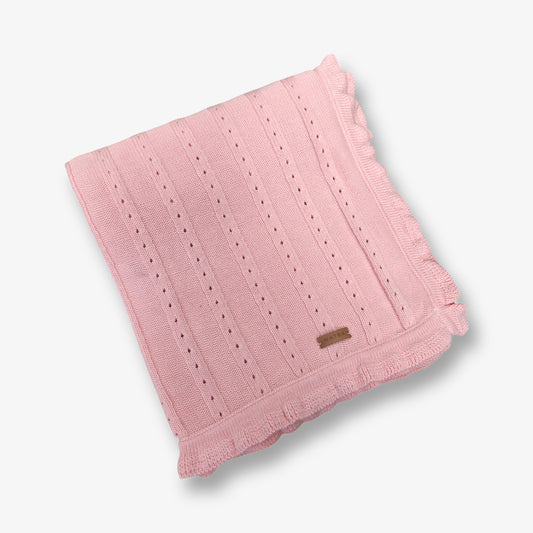 Manta tejida en hilo de algodón en tono rosa